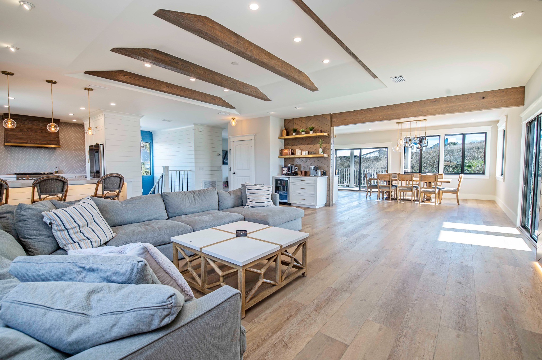 Wide view of the renovated Seascape living, kitchen, and dining spaces